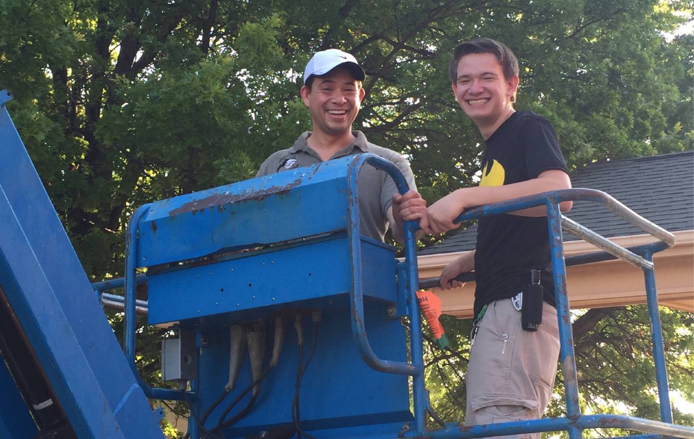 ivan and austin of Bat Specialists standing in a cherry picker